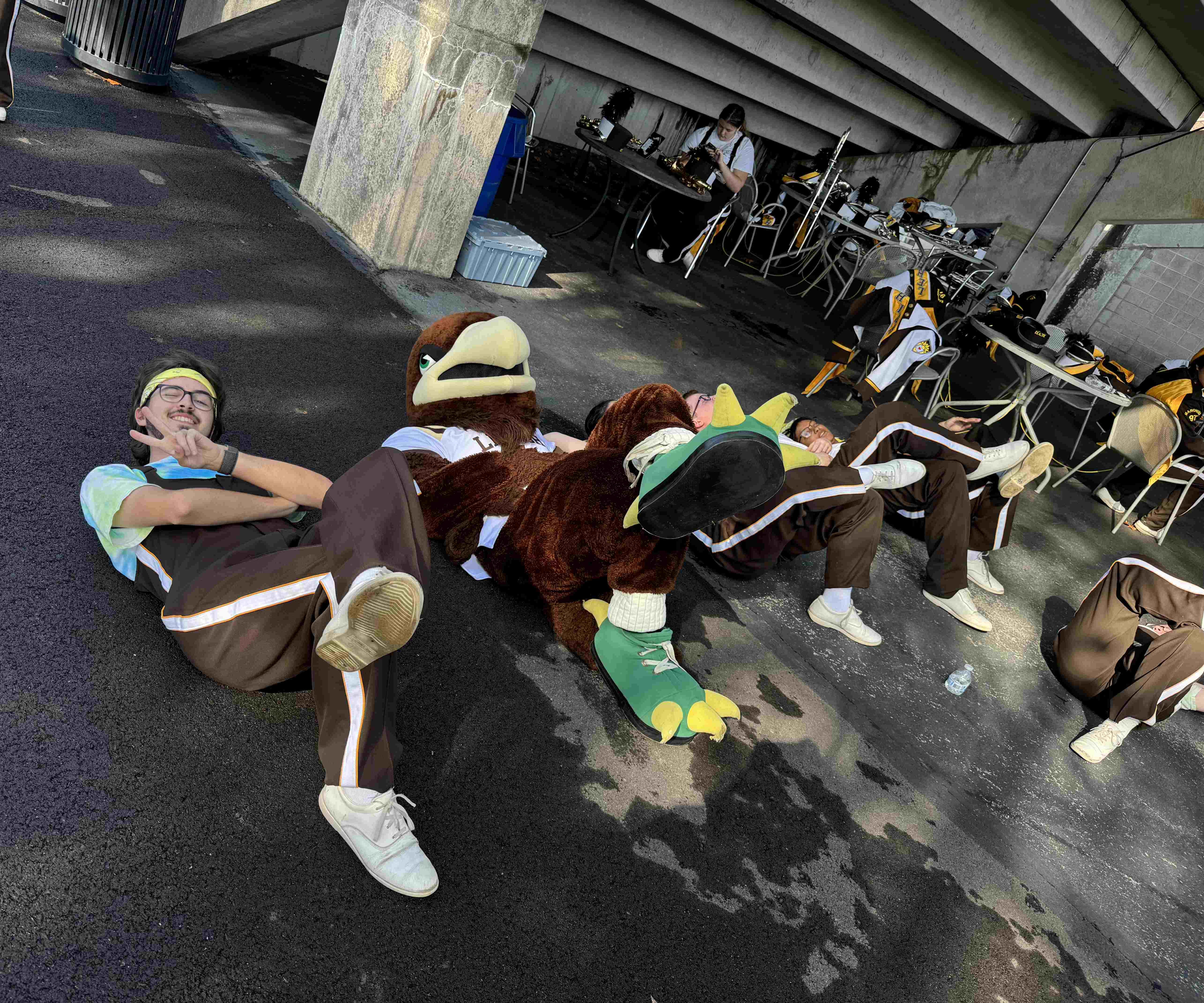 97 members posing on the ground with Clutch the Mountain Hawk