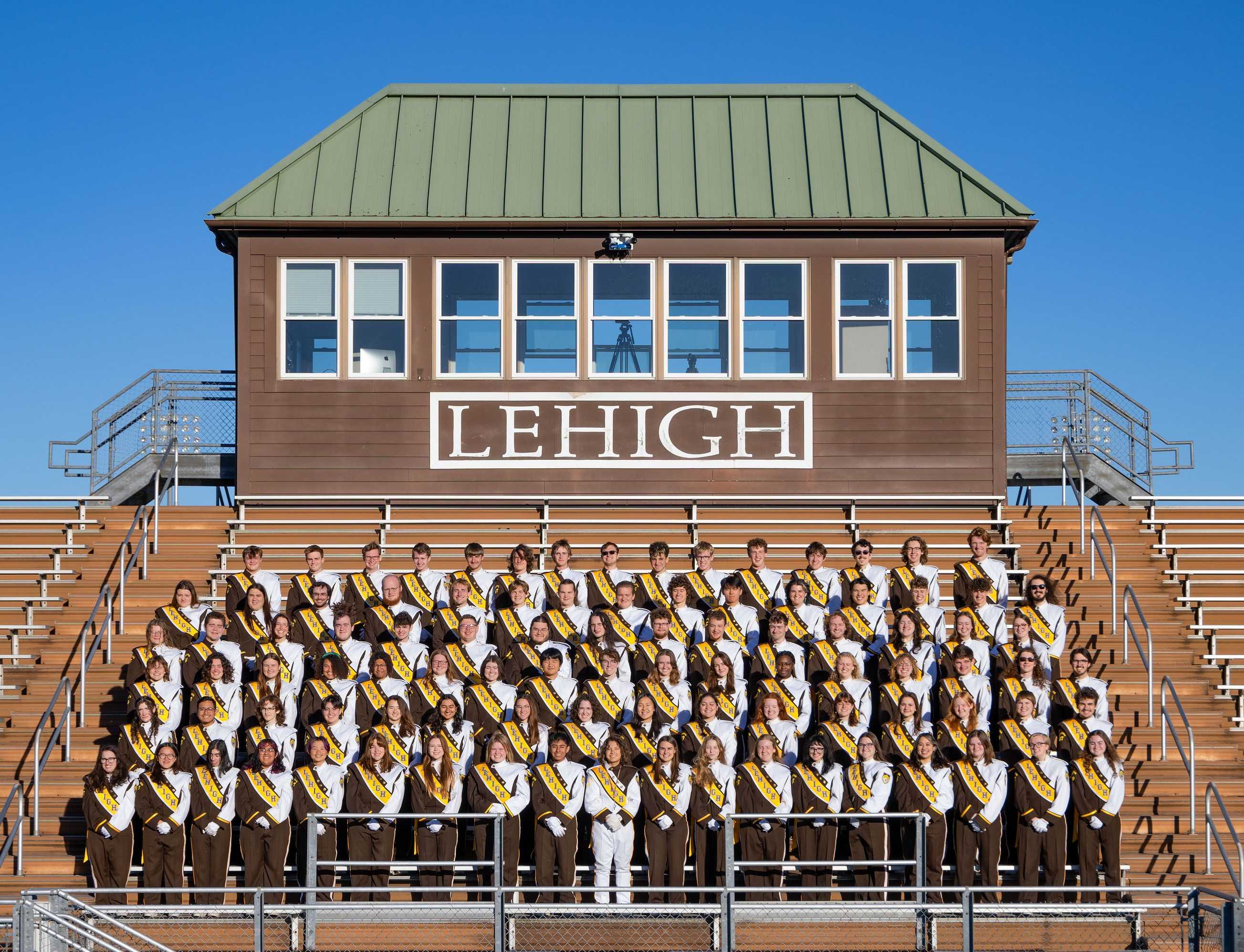The entire band in uniform in the stands