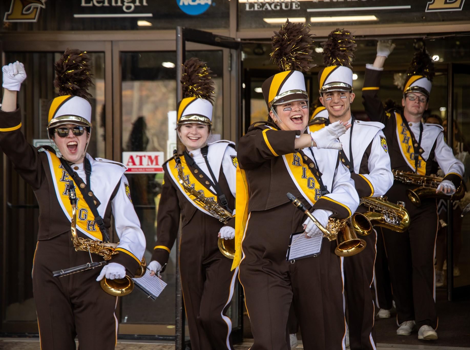 Tenor saxophonists cheering at the start of tailgating