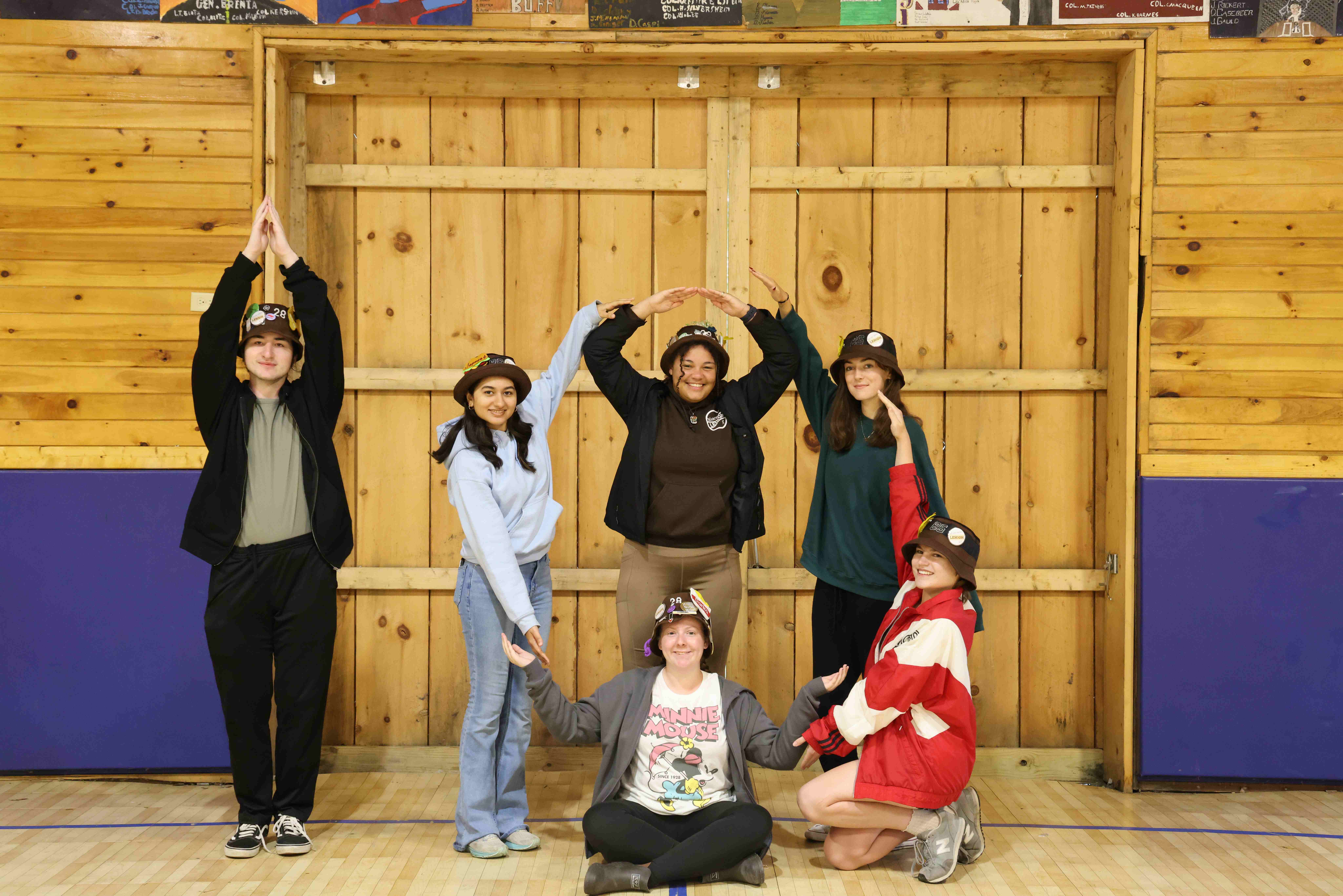 Rank 10 forming a big 10 with their arms.