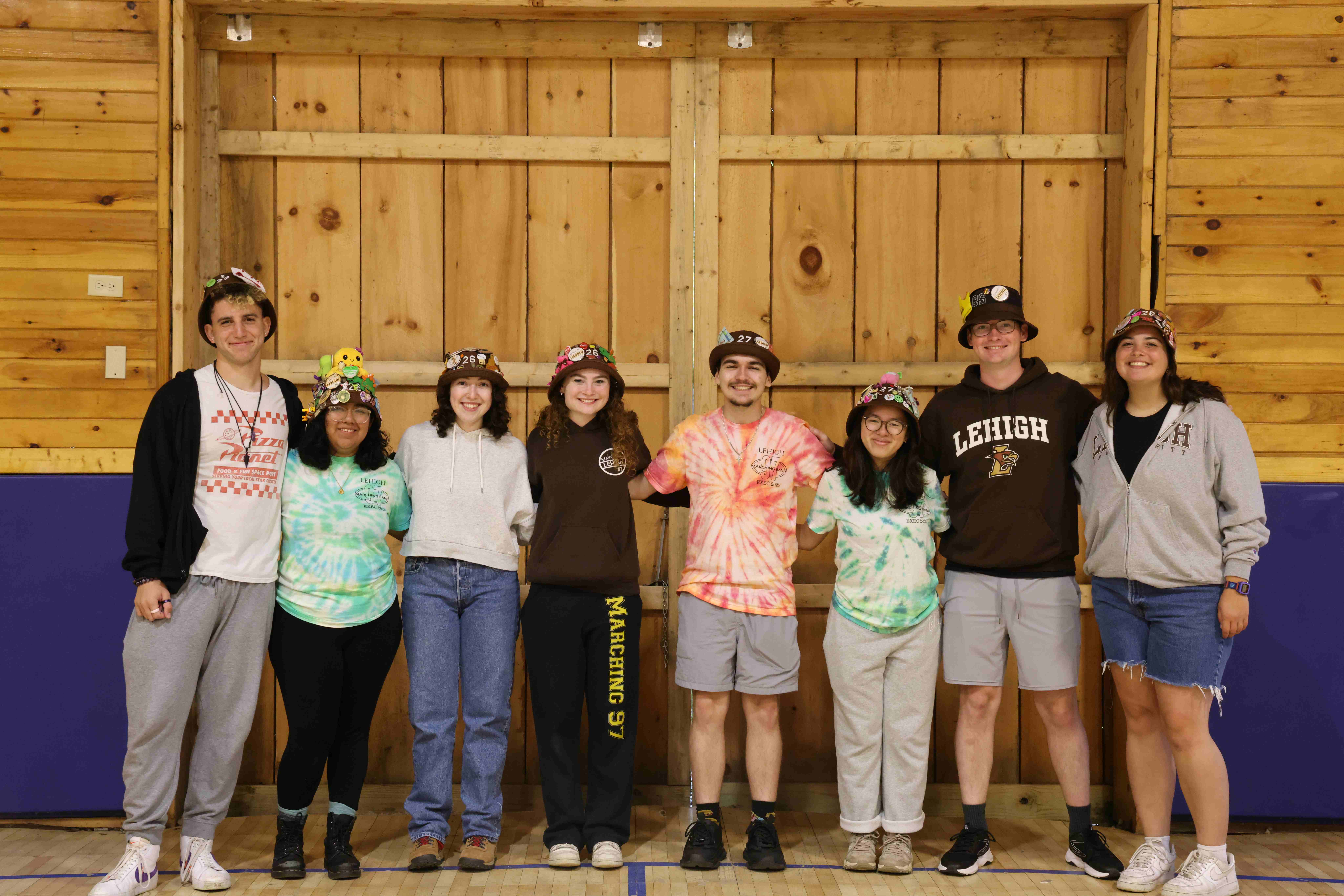Rank 11 smiling with their arms around each other at band camp.