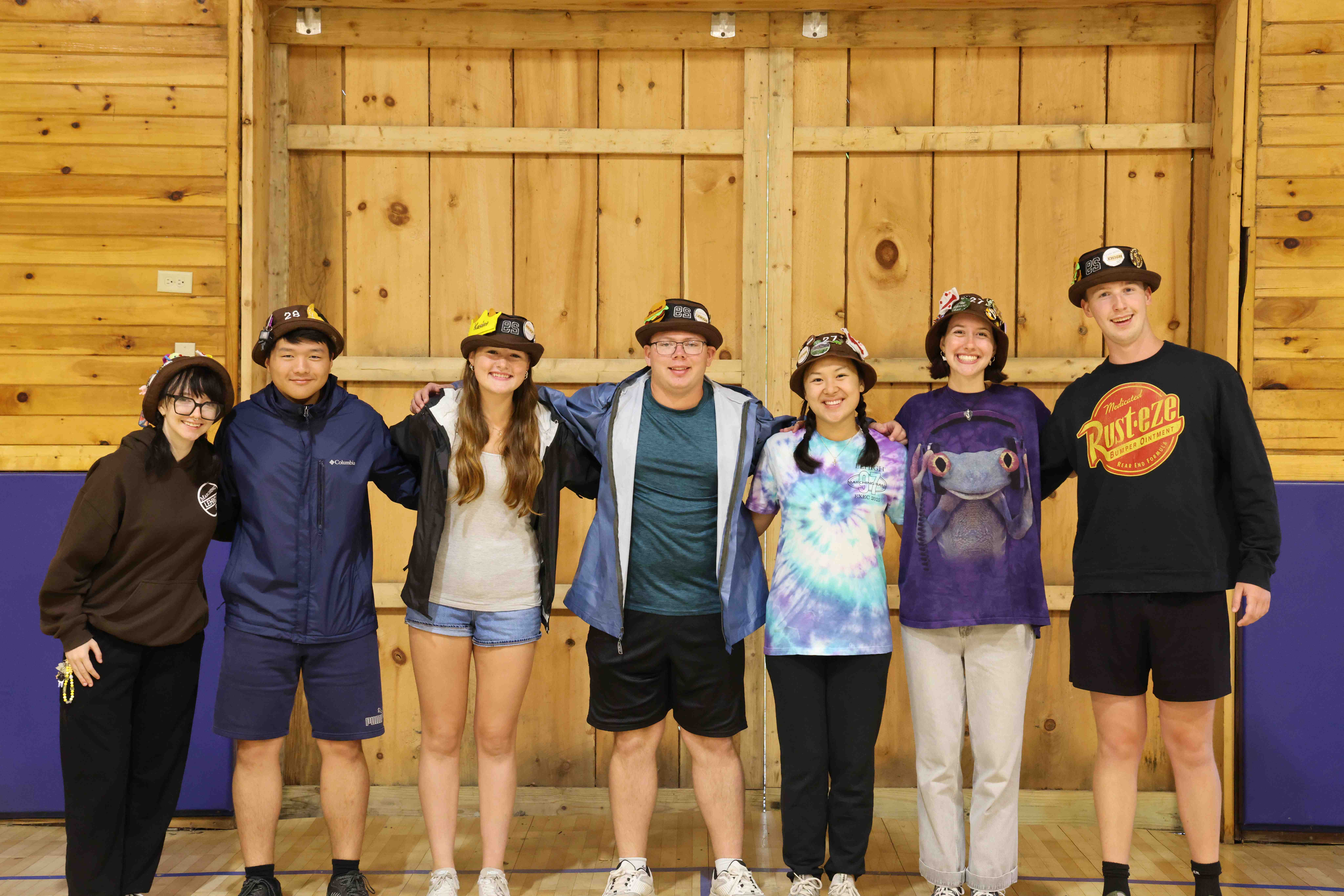 Rank 8 smiling with their arms around each other at band camp.